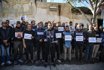 Members of the press in the Gaza Strip, carry banners reading ‘the press is free and cannot be silenced’ during a demonstration due to being targeted by the Israeli army