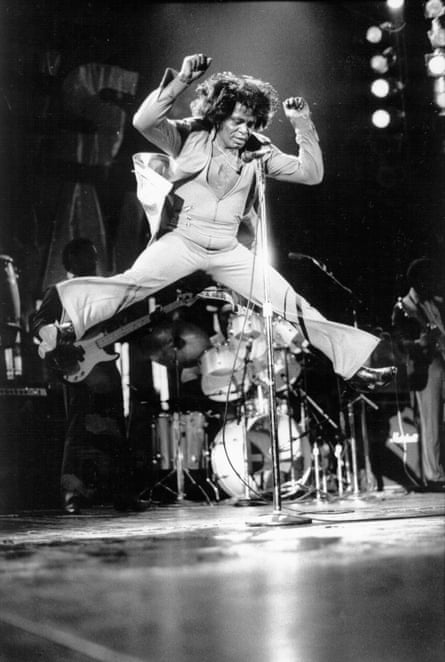 R&B singer and songwriter James Brown leaps in the air during a performance at the Hammersmith Odeon, London, England on May 23 1985