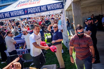 Charlie Kirk throws a “Make America Great Again” hat to the crowd at Utah Valley University on September 10.