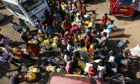 People from the drought-affected districts of Maharashtra collect water from a tank in Mumbai.