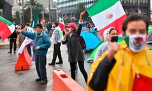 Members of the National Front Anti-AMLO (Frena), who will make a third attempt to reach Zocalo Square to protest against Mexican President Andres Manuel Lopez Obrador (ALMO), wave flags and shout slogans while camping on Reforma Avenue in Mexico City on September 21, 2020, after being prevented by the local police to get to the city’s main square amid the coronavirus pandemic.