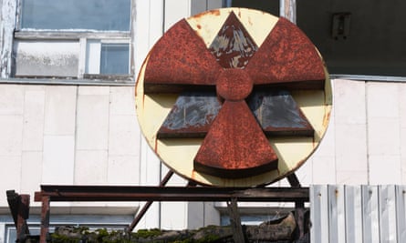 A rusting nuclear sign on a building in Pripyat, which was evacuated within days of the Chernobyl disaster.