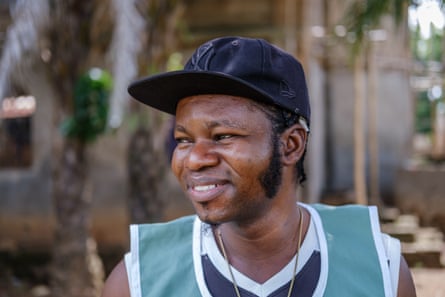 Portrait of Olamilekan Adekeye, 26, a Nigerian man successful a shot cap.