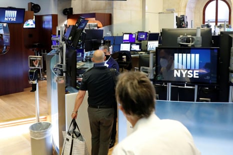 Traders arrive for work, on the first day of in person trading since the closure during the outbreak of the coronavirus disease (COVID-19) on the floor at the New York Stock Exchange (NYSE) in New York, U.S., May 26, 2020.