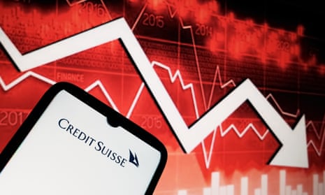 Credit Suisse logo seen displayed on a smartphone screen and an illustrative stock chart background