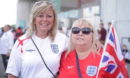 Female football fans attending an England match at Wembley.