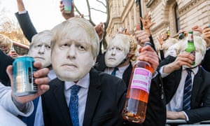 A group of men dressed as Boris Johnson stage a mock lockdown party protest outside Downing Street.
