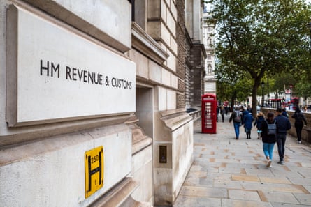 People walk past HMRC’s offices in Whitehall, London