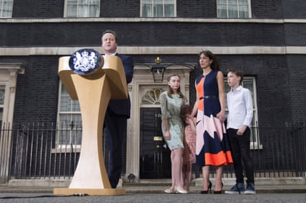 David Cameron speaks as he leaves Downing Street for the last time watched by his family on 13 July