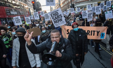 British Nigerians and fellow supporters march through central London to demand the disbanding of the Sars unit in October.