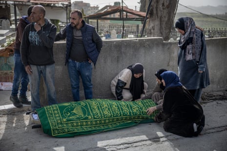 Family members grieve over the bodies of 19-year-old Fatma El Ibrahim and her sister, 23-year-old Sara El Ibrahim, killed when an Israeli airstrike struck their home in Lebanon’s Nabatieh