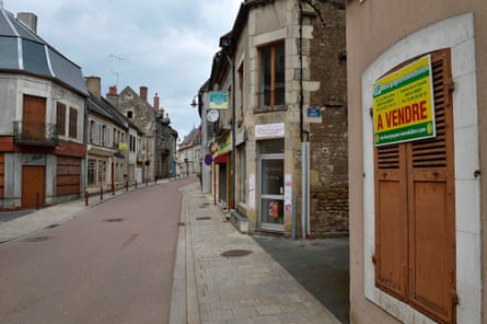 'For sale' signs in the empty streets of Varzy, France.