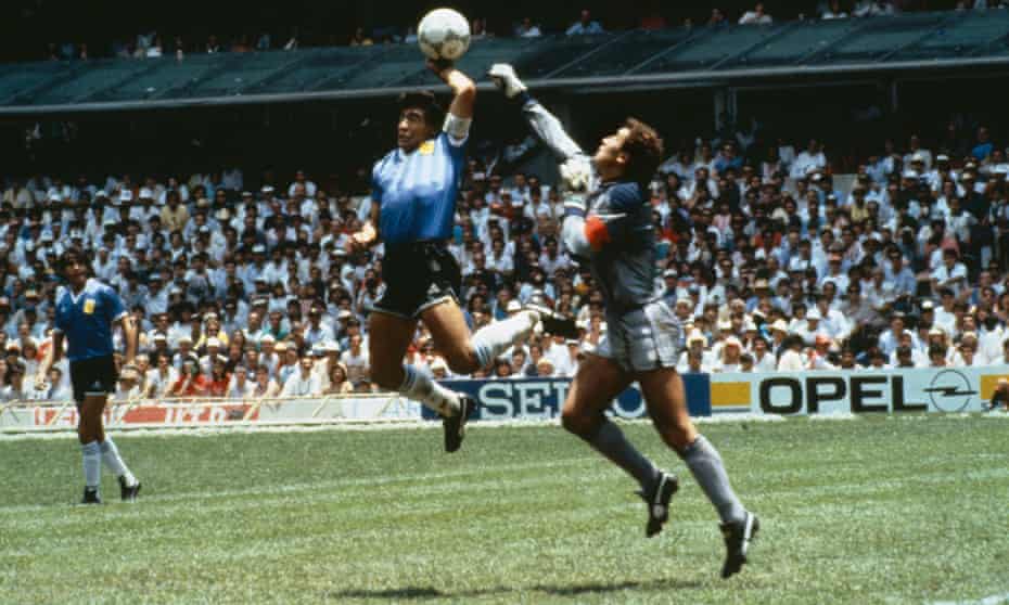 Diego Maradona tickles the ball over the head of England’s Peter Shilton to give Argentina a 1-0 lead at the Azteca Stadium.
