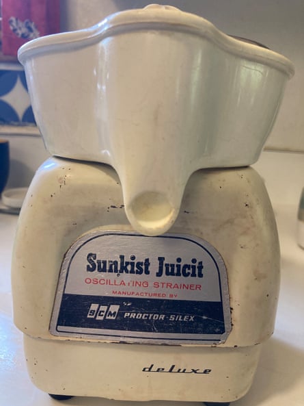 A white, very sturdy looking juicer