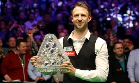 Judd Trump poses with the Masters trophy after beating Ronnie O’Sullivan 10-4.