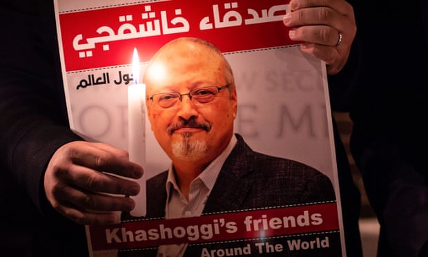 A demonstrator holding a poster of Jamal Khashoggi outside the Saudi consulate in Istanbul