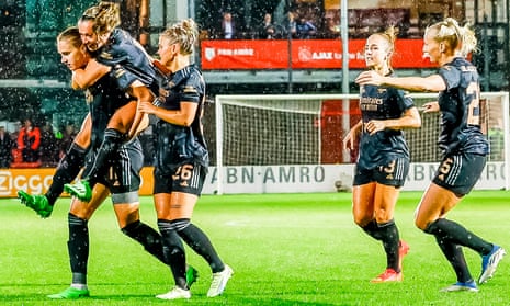 Vivianne Miedema is congratulated by her Arsenal teammates after scoring against Ajax