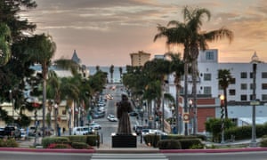 Statue overlooking Downtown Ventura at sunset