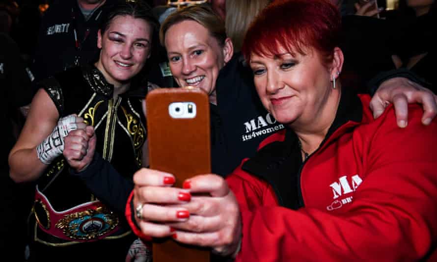 Katie Taylor poses for a selfie with fans following her victory over Christina Linardatou in 2019.