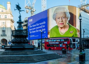 An electronic display in Piccadilly Circus, London, shows an image of the Queen along with a quote from her address to Cop26: 'The Time for words has moved now to the time for action.'