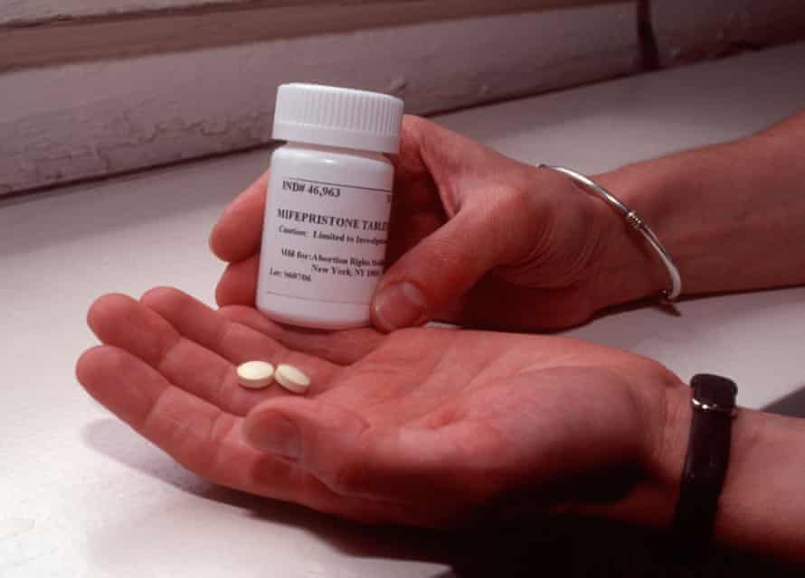 A bottle and two pills of mifepristone.