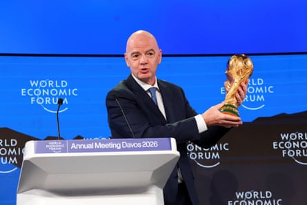 Gianni Infantino holds the World Cup trophy as he attends the annual World Economic Forum meeting in Davos