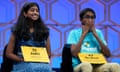 Aditi Muthukumar, 13, of Westminster, Colorado, and Bruhat Soma, 12, of Tampa, Florida, react as they compete in the finals of the Scripps National Spelling Bee on Thursday night.