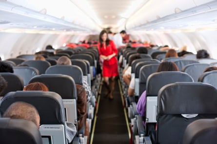 Passengers inside the cabin of a commercial airliner during flight