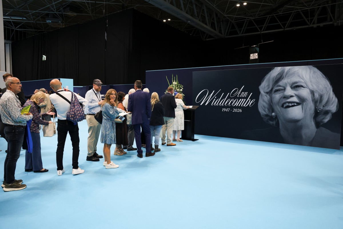 Attendees at the Reform UK conference queuing up to sign a tribute to Ann Widdecombe