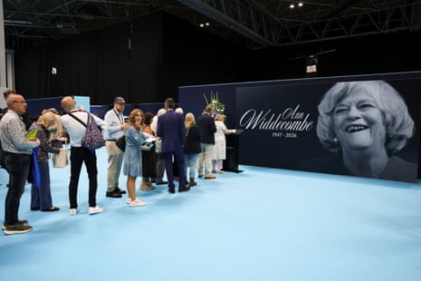 Attendees at the Reform UK conference queuing up to sign a tribute to Ann Widdecombe