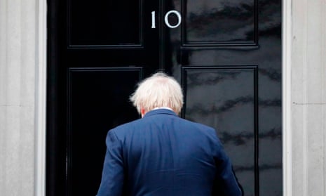 Boris Johnson returns inside after participating in a national ‘clap for carers’ to show thanks for the work of Britain’s NHS (National Health Service) workers and other frontline medical staff.