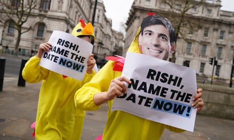 Demonstrators dressed as chickens protest opposite Downing Street in London