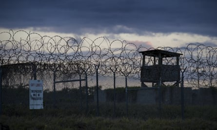 The sun sets behind the closed Camp X-Ray detention facility, Wednesday, April 17, 2019.