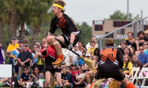 A Bowling Green State University player leaps into the air at the Quidditch World Cup VI in Kissimmee, Florida, April 2013.