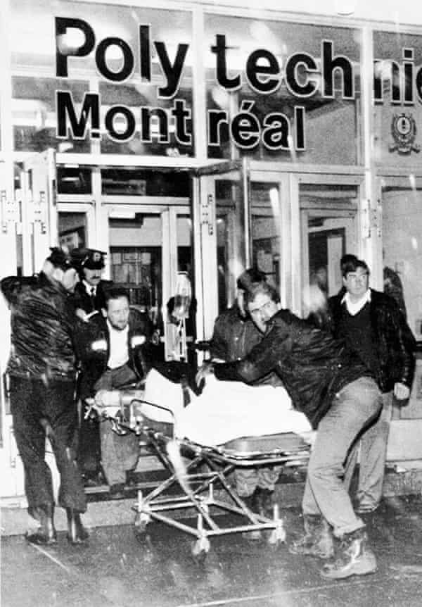 A victim is wheeled away from the scene after a gunman opened fire in a packed classroom on 6 December 1989.
