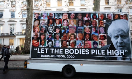 Billboard truck bears image of Johnson and the quote attributed to him: ‘let the bodies pile high’ in front of photographs of people who died
