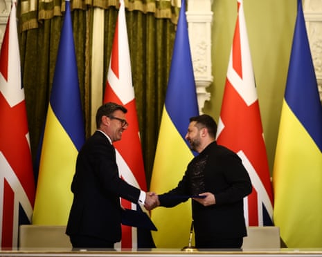 Ukraine's president Volodymyr Zelenskyy and prime minister Andy Burnham shake hands after signing a partnership deal in Kyiv in August.