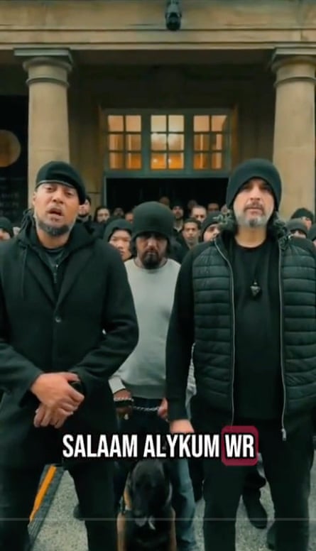 Hashem and other men outside building
