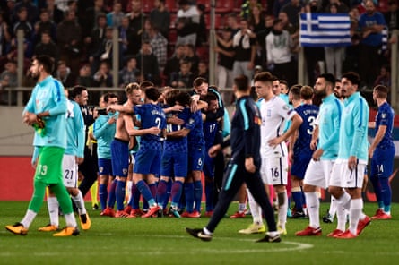 Greece players look on as Croatia seal their place at the World Cup.