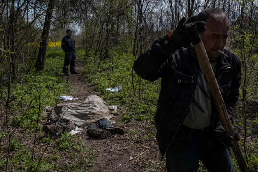 In the woods on a roadside near Borodyanka, 40 miles from Kyiv, police were overseeing the exhumation of two men who were executed and buried next to what locals say was a Russian military checkpoint.