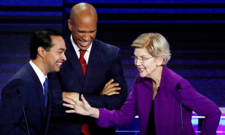 Elizabeth Warren speaks with Julián Castro and Cory Booker at the first Democratic debate in Miami, Florida, on 26 June.