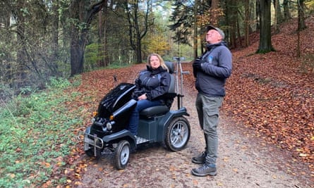 woman on Tramper and man listening to birds