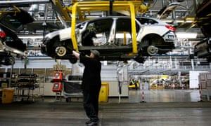 A worker on the production line of General Motors’ Vauxhall plant in Ellesmere Port in Cheshire.