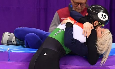 Team GB’s Elise Christie gives here boyfriend Sandor Liu Shaolin a congratulatory hug as they celebrate his team’s gold medal.