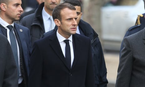 Emmanuel Macron inspects the damage after violent clashes in Paris
