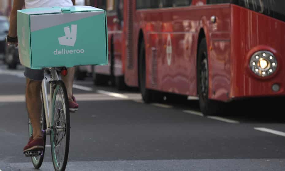 A cyclist delivers food for Deliveroo in London.