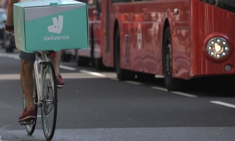 A cyclist delivers food for Deliveroo in London