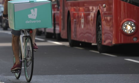 A cyclist delivers food for Deliveroo in London