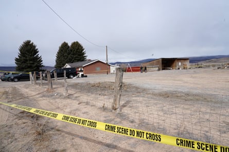 Crime tape surrounds a home where a woman was found dead in Lyman, Utah, on Thursday.