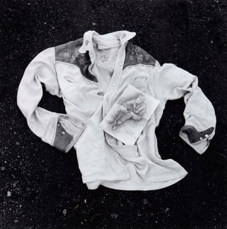 Black and white shot of a western shirt lying on the ground